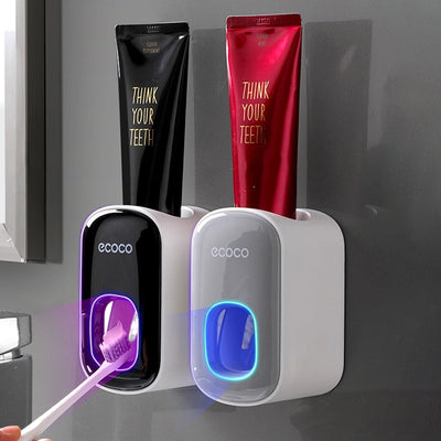 ECOCO Automatic Toothpaste Dispenser and Toothbrush Holder in bathroom setting.